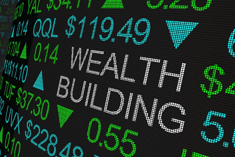 Text that says Building Wealth surrounded by stock values